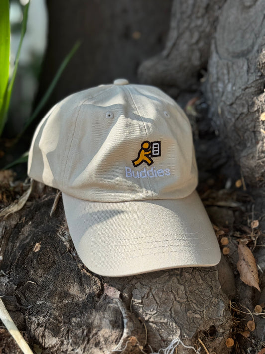 Beige cap with a logo and text on a textured surface