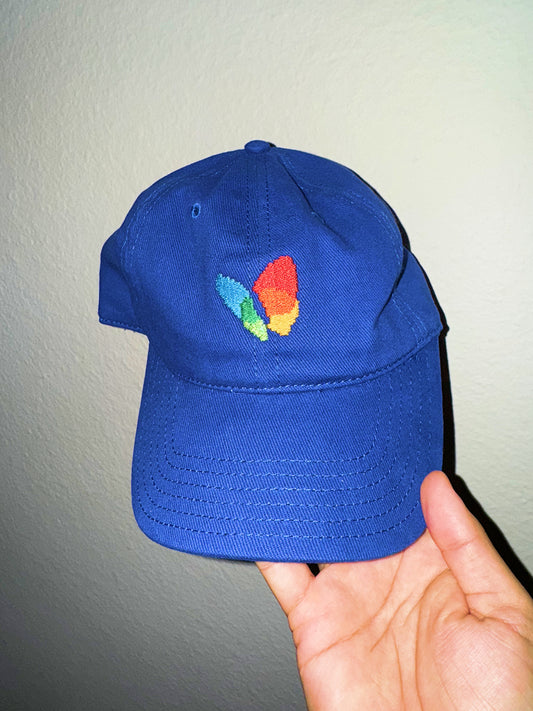 msn explorer icon on blue dad hat held by a hand against a neutral background in y2k flash photo style